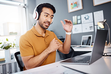 Image showing Video call, laptop and man explain on webinar or virtual meeting for business planning in his office. Creative asian person with headphones on computer online discussion, speaking or client advice