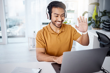 Image showing Video call, computer and headphones of man in work from home office for webinar or virtual meeting, online and talking. Happy Asian person waves hello on his laptop or pc in client chat for business