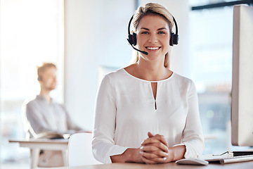 Image showing Portrait, customer service and happy with a woman consultant working in her office for after sales support. Call center, contact us and crm with a young female employee consulting using a headset