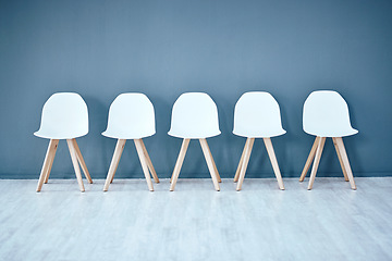 Image showing Human resources, hiring and recruitment with a row of chairs in a studio on a gray background waiting area. Interview, room and furniture in an empty or minimalist hr office in a corporate company