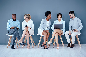 Image showing Business people, meeting and waiting room for interview, networking or job opportunity at the office. Diversity and group of employees sitting in row for recruitment process, collaboration or hiring