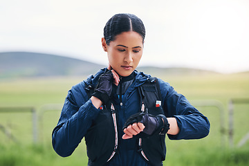 Image showing Heart rate, time and woman in the countryside ready for fitness and exercise checking pulse. Sports, training and smart watch of a female athlete looking at workout app for health and wellness