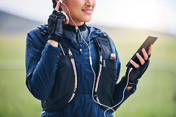 Image showing Music, phone hands and woman in the countryside ready for fitness and exercise with mockup. Sports, run training and mobile headphones of a female athlete with audio and web radio for workout