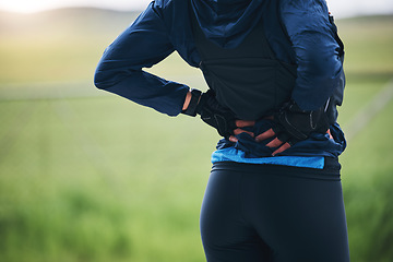 Image showing Back pain, fitness and sports woman outdoor with scoliosis, health risk and burnout from marathon. Closeup female athlete, spine injury and joint problem of tired muscle, first aid and emergency care