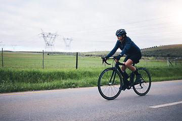 Image showing Woman, bicycle exercise and nature road for fitness, health and eco friendly travel on summer adventure. Cycling girl, bike and speed for workout, training or journey on countryside street for sports