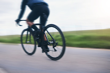 Image showing Person, bicycle athlete and cycling on motion blur in nature, countryside and training for triathlon from behind. Cyclist, mountain bike and speed on road for sports, power or cardio competition race