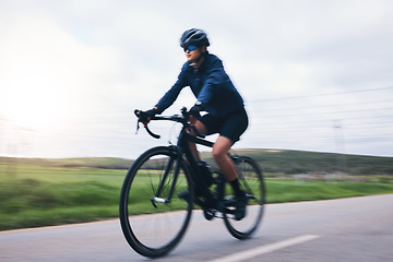 Image showing Woman, bicycle and nature road with motion blur for fitness, health and eco friendly travel on summer adventure. Cycling girl, bike and fast at workout, training and journey on countryside street