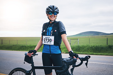 Image showing Portrait, cycling or happy woman in nature with bicycle for exercise, workout or training for triathlon fitness. Girl cyclist, sports or biker on break exercising for cardio endurance with smile