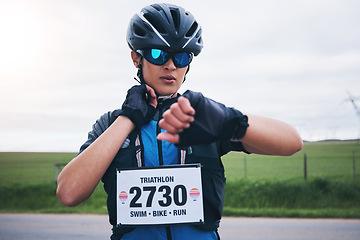 Image showing Woman, cyclist and check heart rate on watch, timer and monitor health progress in triathlon race. Female bicycle athlete, neck pulse and stopwatch for cycling performance, cardio training and sports