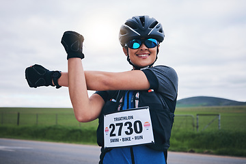 Image showing Stretching, triathlon and cycling with woman in road for training, competition and workout. Warm up, fitness and exercise with female cyclist in nature ready for performance, summer and marathon