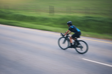 Image showing Person, cycling and speed with motion blur outdoor on bike in countryside of training, triathlon and sports power. Athlete, bicycle and marathon race of fitness, energy and performance on mockup road