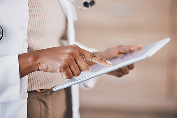 Image showing Doctor, woman and hands on tablet for research, Telehealth or healthcare at the hospital. Hand of female medical professional in data analysis or health insurance holding technology at the clinic