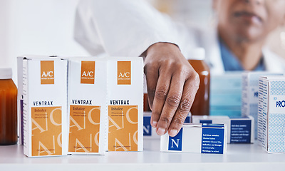 Image showing Pharmacist hand, shelf or packing box for stock, inventory or organized store for wellness. Pharmacy business owner, woman and medicine to organise pills for customer experience at retail health shop