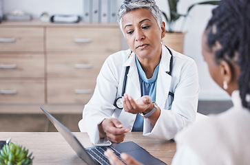 Image showing Doctor, laptop and woman consulting results, healthcare prescription or medicare diagnosis at desk. Senior female medical expert in consultation, research or health advice on computer at clinic