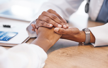 Image showing Closeup, holding hands and doctor with support for patient with consulting, listening and empathy at desk. Medic, woman and helping hand for solidarity, care and counselling for health with bad news