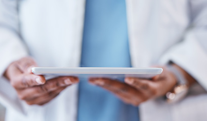 Image showing Doctor, hands and tablet for healthcare research, Telehealth or communication at the hospital. Hand of medical professional in data analysis, health or life insurance holding technology at the clinic