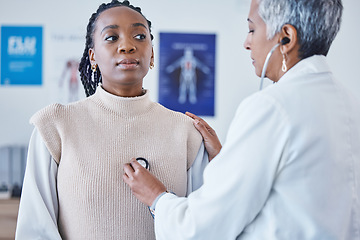 Image showing Doctor, black woman and stethoscope on chest, breathe and test for lung healthcare and advice at clinic. Patient consulting medical professional, health care check and cardiovascular help at hospital