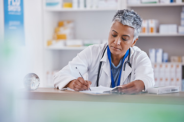 Image showing Woman, doctor and writing on clipboard at pharmacy for healthcare prescription, diagnosis or inventory at counter. Female medical professional taking notes on pharmaceutical products at the clinic