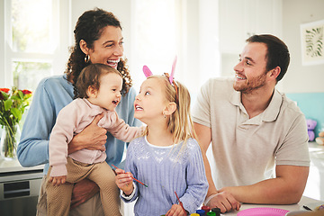Image showing Parents, girl children and bunny ears in family home with funny face, baby or happiness for easter. Man, woman and kids in house, laughing and excited for christian holiday with love, care or bonding