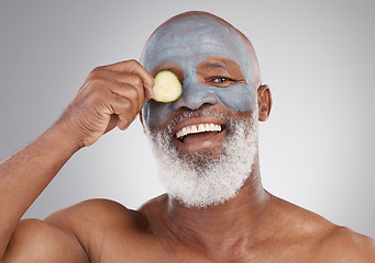 Image showing Facial mask, cucumber and black man with smile in portrait, beauty and skincare isolated on studio background. Happy senior male, cosmetic care and healthy skin, anti aging cosmetics routine for face