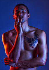 Image showing Sexy, beauty and man in dark light with chest tattoo as body art and model isolated in a studio background closed eyes. Creative, topless and young artistic person with seductive look in a shadow