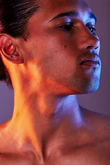 Image showing Beauty, neon and face of man in studio for skincare, self care and facial treatment on purple background. Creative aesthetic, glow and profile of male model for healthy skin, wellness and confidence