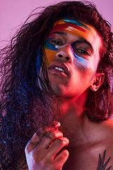 Image showing Creative, face paint and art with portrait of man in studio for beauty, self love and designer. Fantasy, neon and light with male model on pink background for makeup, colours and cosmetics