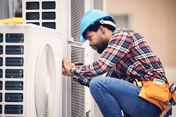 Image showing Black man, electrician and maintenance on air conditioner with engineering and handyman working with tools on roof. AC repair, professional male technician outdoor and power generator with service