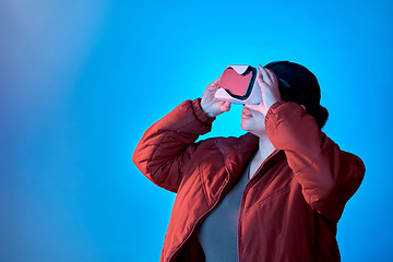 Image showing Vr gaming or woman in metaverse studio for future innovation, cyber or 3d on blue background. Futuristic media mockup, technology software or girl gamer with digital virtual reality glasses online