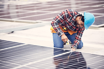 Image showing Solar panel, repair and engineering man on rooftop with tools, energy saving and sustainable power maintenance. African person, electrician contractor or technician working on photovoltaic generator