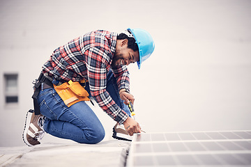 Image showing Solar panel installation, engineer and black man on roof, sustainable or renewable energy mockup. Technician, photovoltaic electricity and happy person in maintenance or inspection with screwdriver.