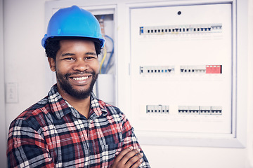 Image showing Black man in portrait, technician and electricity fuse box, check power supply with maintenance on main circuit breaker. Engineer, electrician and male worker with smile, handyman and electrical fix