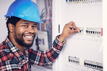 Image showing Black man in portrait, electrician and electricity fuse box, check power supply with maintenance on main circuit breaker. Engineer, technician and male worker with smile, handyman and electrical fix