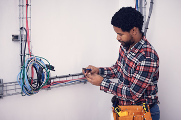 Image showing Technician, black man and electrician checking cables, fixing faulty wires and server mechanic. Male employee, entrepreneur and engineer with tools, electrical and maintenance with handyman and focus