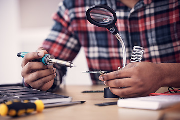 Image showing Man, technician hands and soldering iron fixing electronics, magnifying glass and computer hardware repair. Technology maintenance, tools and engineering with electrical fix and male working