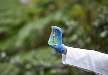 Image showing Science, nature and scientist hand with beaker for liquid sample inspection, environment and ecosystem. Agriculture, biology and person with glass in forest for analysis, research and study mock up