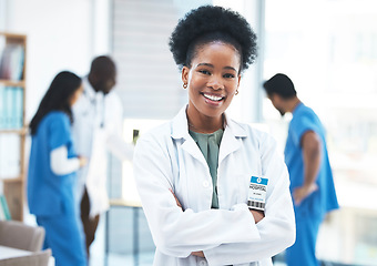 Image showing Black woman, doctor leader and arms crossed in portrait at clinic for goals, excited and career vision. Female medic, leadership and management with confidence, success and happy for job at hospital