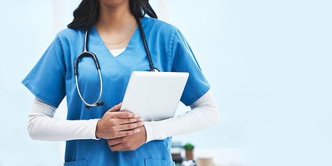 Image showing Hands, tablet and doctor at hospital with space for promotion, mockup and wellness branding. Woman, medic and mobile touchscreen for telehealth mock up, service or consulting in clinic for healthcare