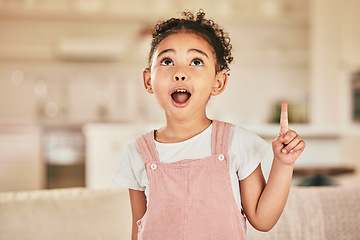 Image showing Girl child, wow and point with smile in home living with happiness, youth and thinking of idea. Happy female kid, excited and hand gesture for surprise in lounge, house and apartment with answer