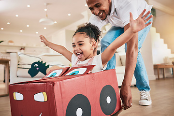 Image showing Car, cardboard and father playing child in fantasy game bonding in a living room or home lounge together. Happiness, happy and single parent or dad having fun with kid or daughter excited to play