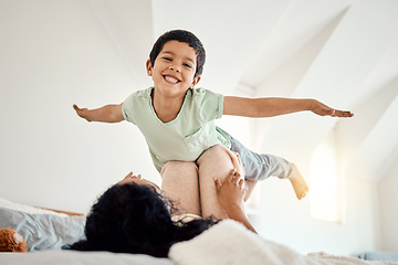 Image showing Love, airplane and portrait of child with mother on a bed, happy and excited in their home together. Flying, game and face of boy with parent in bedroom playing, free and fun while bonding on weekend