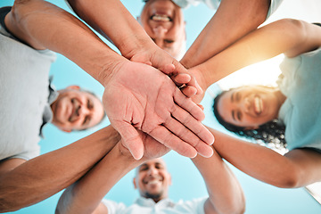 Image showing Happy family, trust and hands together below for teamwork, agreement or collaboration in solidarity. Group of people in community gathering piling hand for unity, celebration or love in partnership