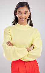 Image showing Woman with smile in portrait, arms crossed with confidence and success isolated on studio background. Young, professional and confident Indian female with positive ambition, happiness and empowerment