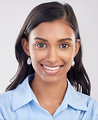 Image showing Face, happy and portrait of Indian woman relax feeling confident, smile and closeup isolated in a studio white background. Employee, head and female worker proud, happiness and confidence