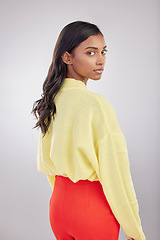 Image showing Serious, stylish and fashion portrait of a woman isolated on a white background in a studio. Indian, young and a model with trendy style, fashionable clothing and a vibrant color outfit on a backdrop