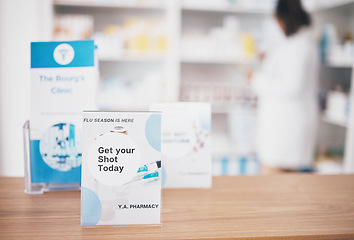 Image showing Flu vaccine, sign and pharmacy poster in a medical shop and clinic for healthcare. Wellness, doctor and covid booster shot advertising placard showing health message for customer on a paper billboard