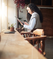 Image showing Tablet, remote work and coffee shop with business woman doing digital work at cafe. Restaurant reading, email and typing of female freelancer online on web app working on social media post planning