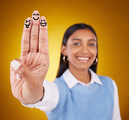 Image showing Smiley, fingers and portrait of indian woman in studio for art, expression and fun on gradient yellow background. Hands, art and drawing by girl smile, excited and content with emoji, gesture or face