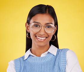 Image showing Happy, glasses and portrait of woman in studio for business, corporate and professional. Smile, pride and happiness with face of female on yellow background for mindset, confident and mockup