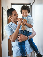 Image showing Love, father and son with a hug, smile and bonding at home, cheerful and quality time. Family, male parent and boy with happiness, kid and child in the living room, joyful and embrace with affection